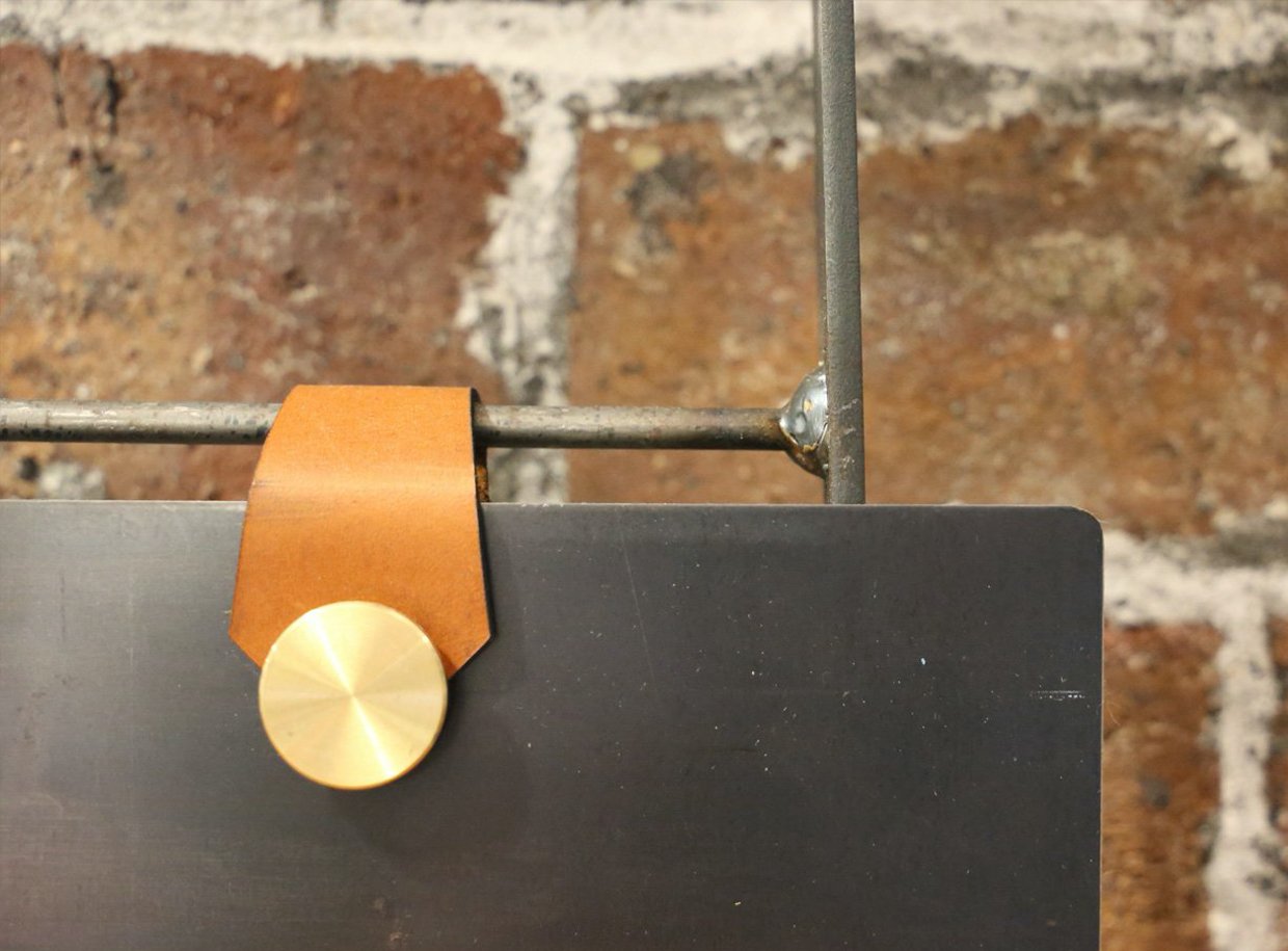 Detail photo of STAKK Steel Display Ladder leather shelf fixing by DYEHOUSE