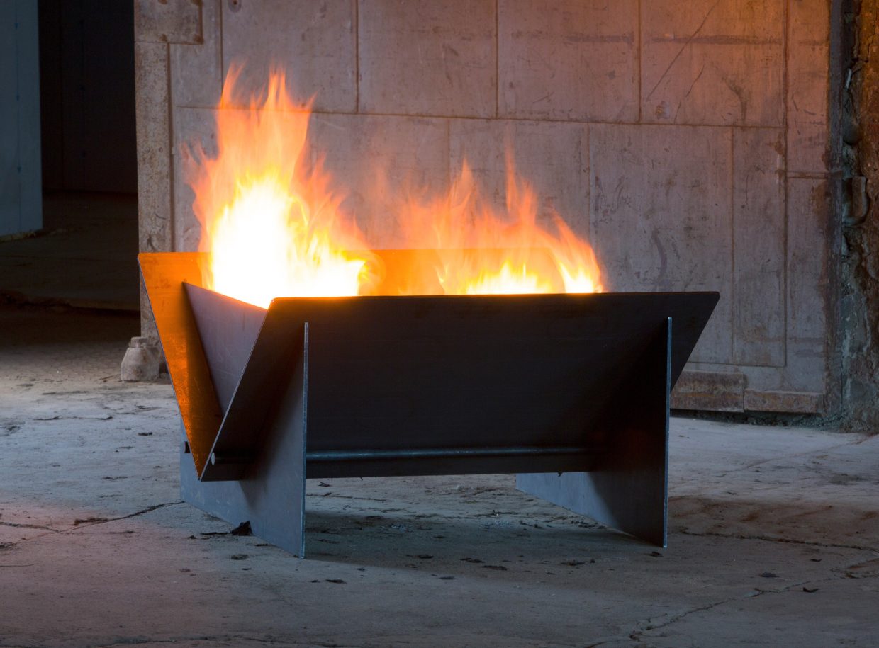 Lit BOURNE steel fire pit by DYEHOUSE